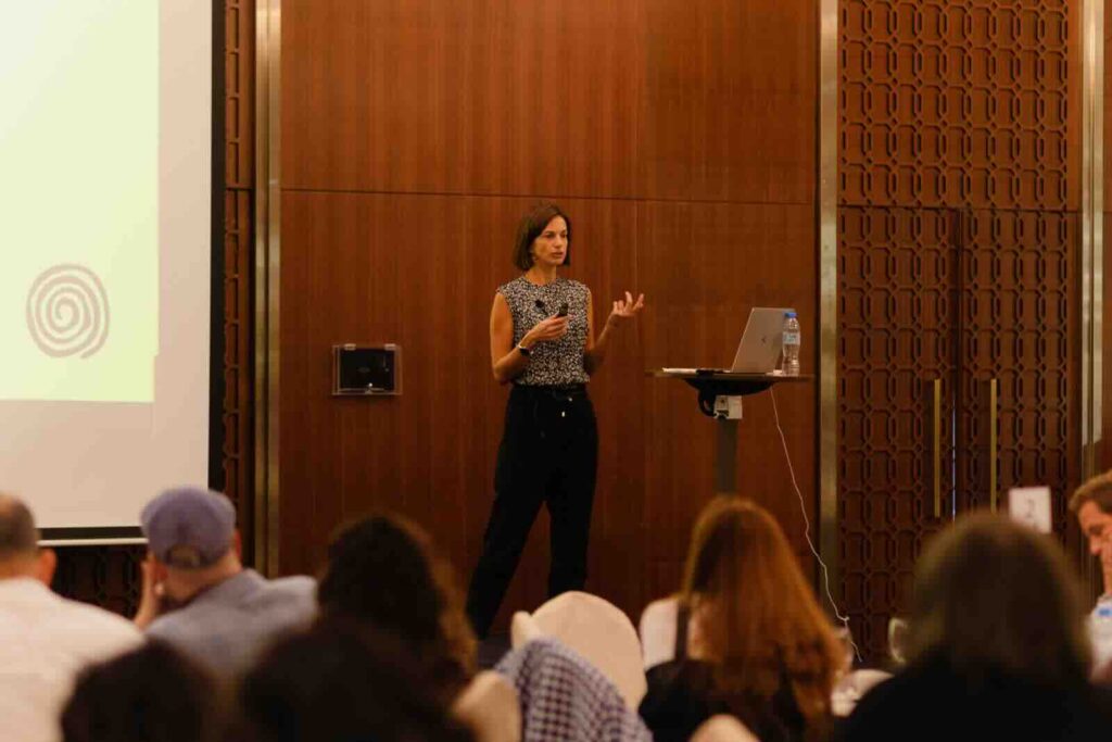 Dr. Laura, top inspirational speaker in Dubai, during a keynote speaking intervention, healthy success, behavioral transformation, MBA, motivational speaker, Dubai, UAE